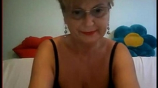 Big breasts granny in glass masturbating on webcam
