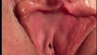 Closeup of a leaking creampie in the throws of big O